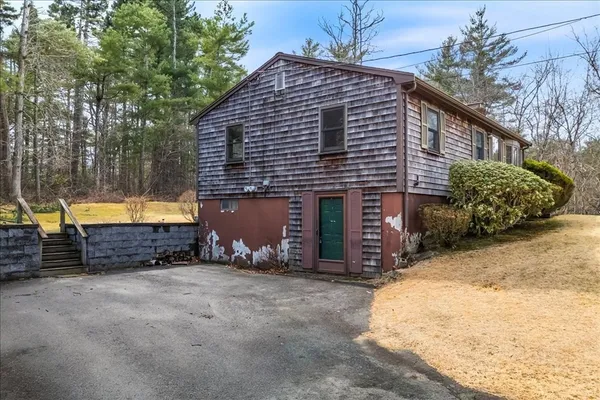 a backyard of house with a yard and garage