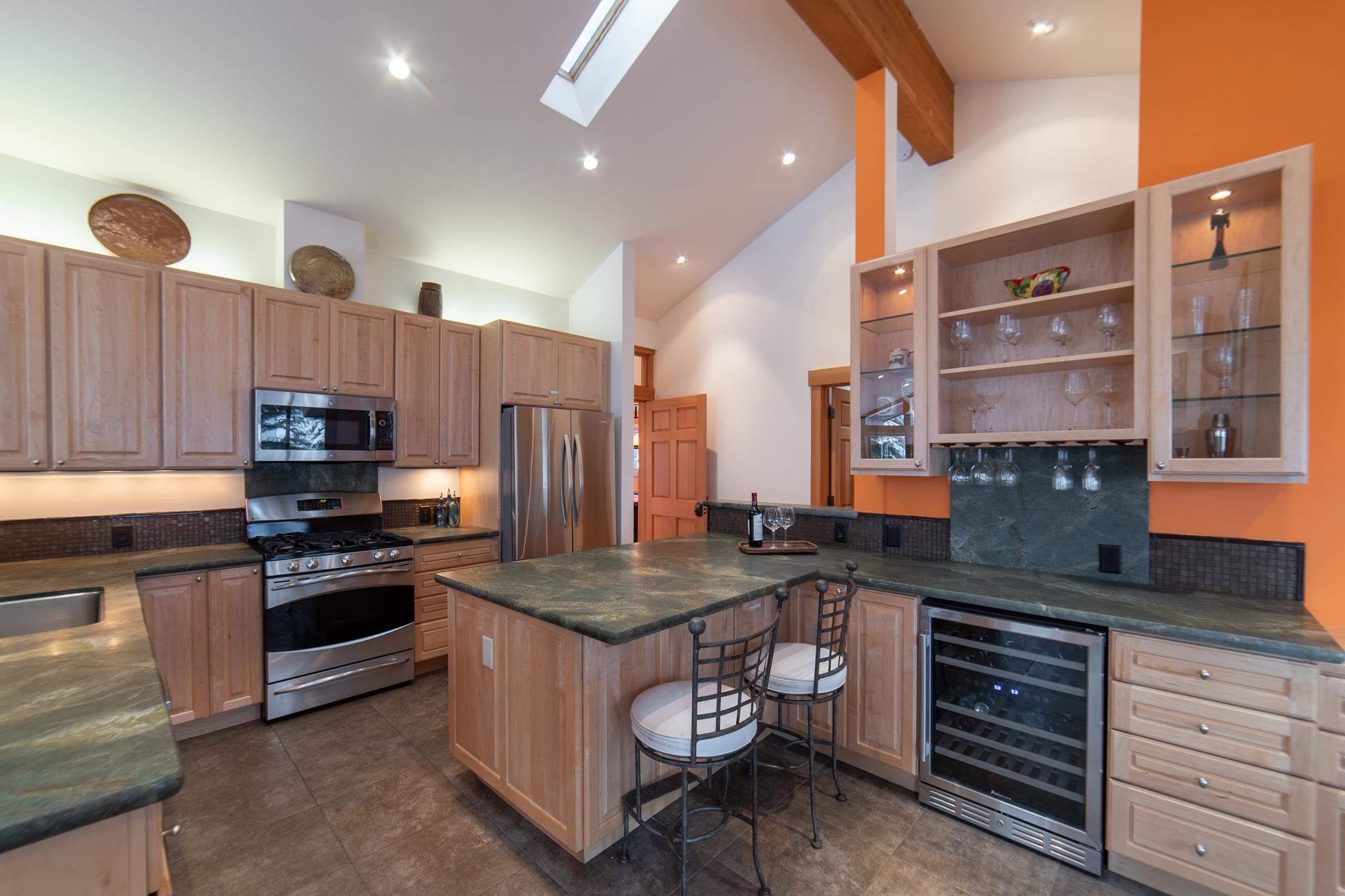 406 Lodgepole Truckee, CA 96161 - Photo 6 of 21 a kitchen with a stove and a refrigerator