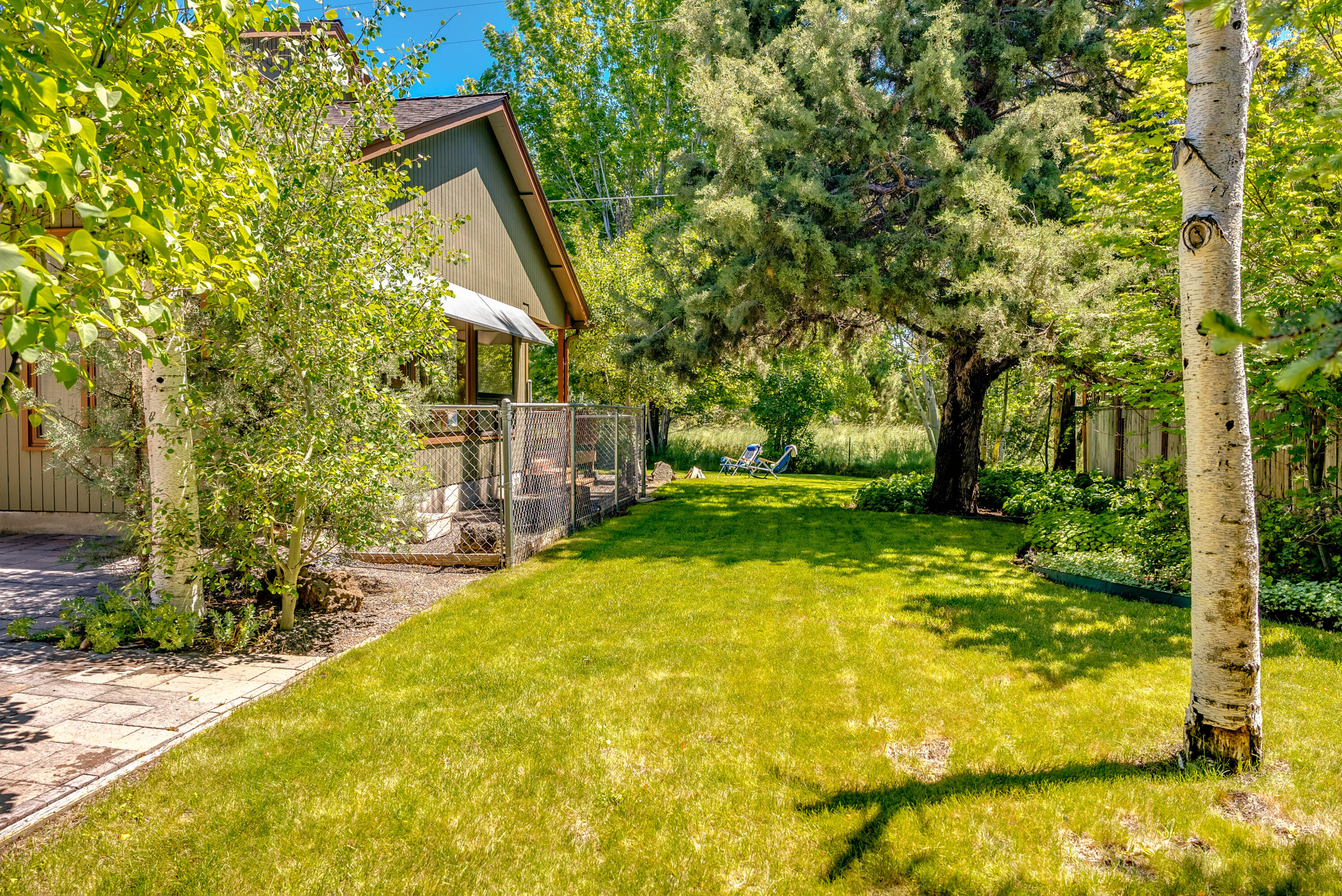 63536 Vogt Road Bend, OR 97701 - Photo 40 of 44 a view of swimming pool with lawn chairs and plants