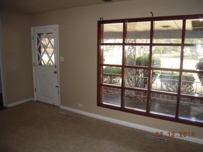 4105 Rutledge Street Gary, IN 46408 - Photo 3 of 10 a view of an empty room with a window