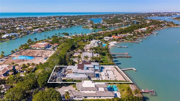 an aerial view of a house with a ocean view