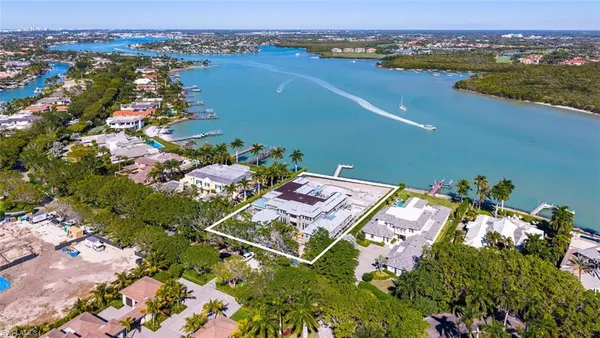 an aerial view of a house with a lake view