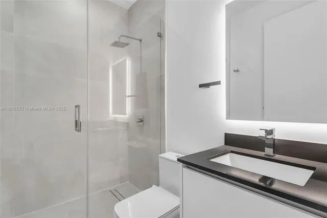 a view of an empty room and closet area