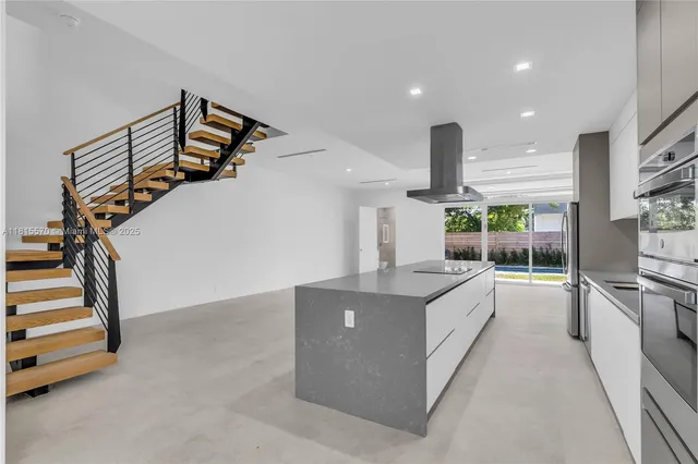 a kitchen with counter top appliance and stove