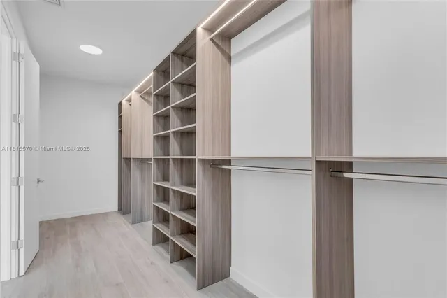 a view of kitchen with granite countertop cabinets and sink
