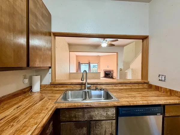 a bathroom with a granite countertop sink and a large mirror
