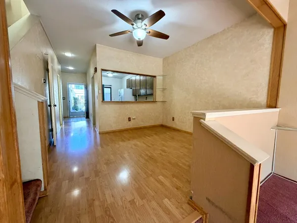 a view of a hallway with a kitchen