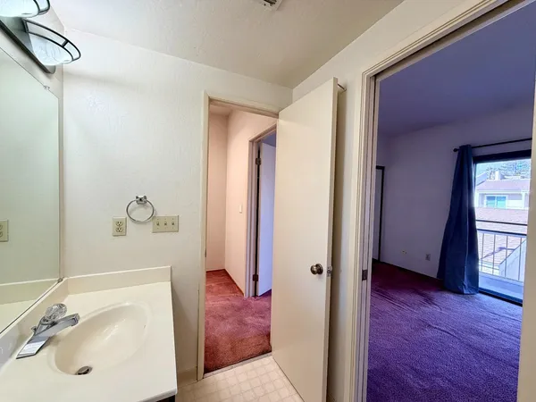 an empty room with wooden floor and a window