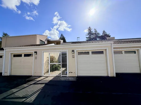 a view of a house with wooden stairs