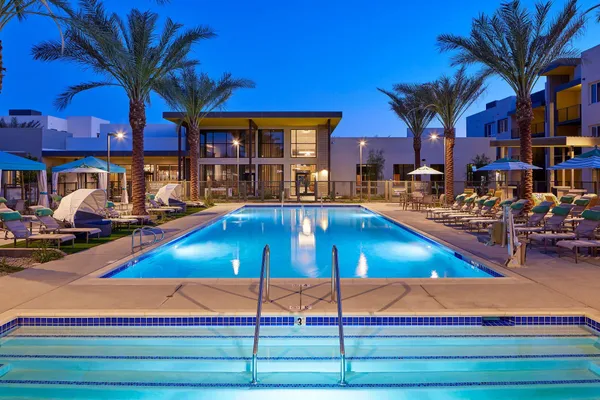 a view of a swimming pool with an outdoor seating