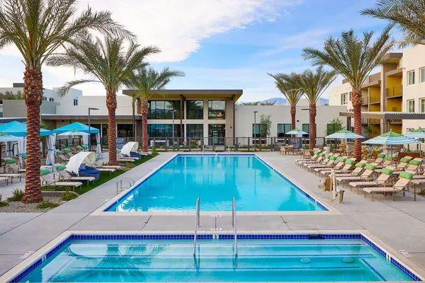 a view of outdoor space with swimming pool and furniture