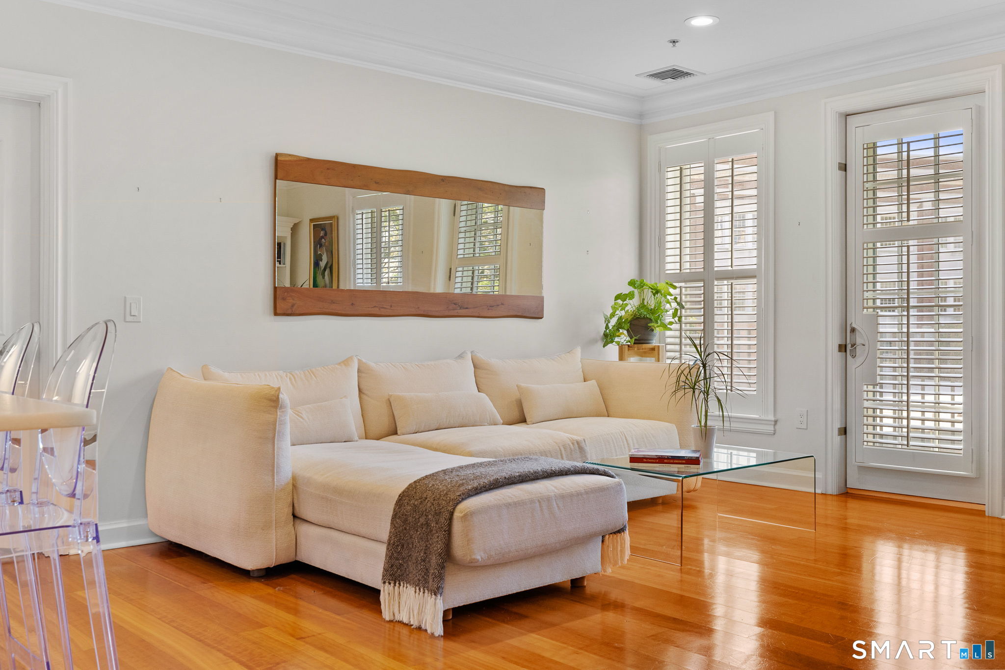 85 Memorial Road, Unit 205 West Hartford, CT 06107 - Photo 12 of 40 a living room with furniture and a wooden floor
