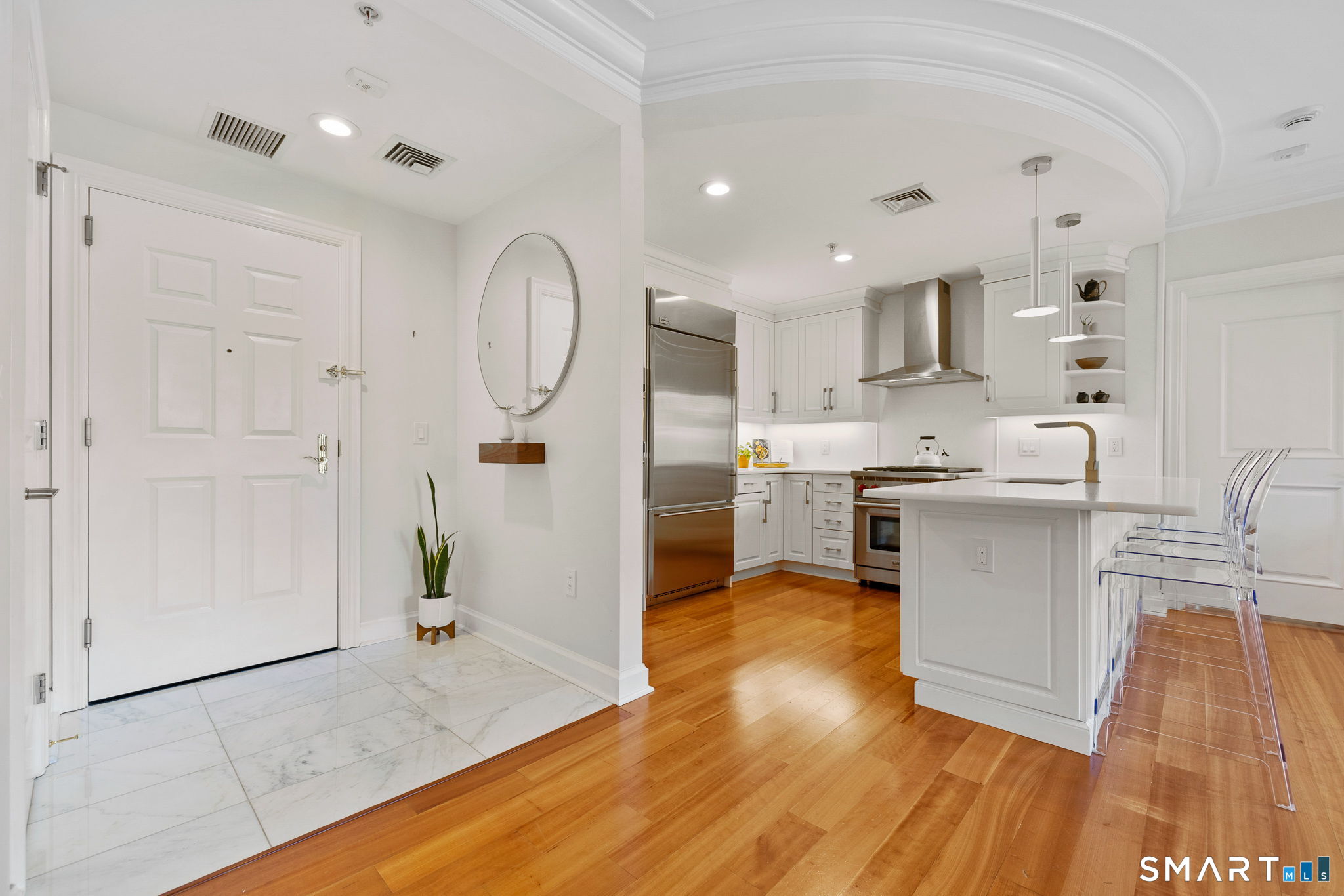 85 Memorial Road, Unit 205 West Hartford, CT 06107 - Photo 2 of 40 a view of kitchen with stainless steel appliances refrigerator oven and cabinets