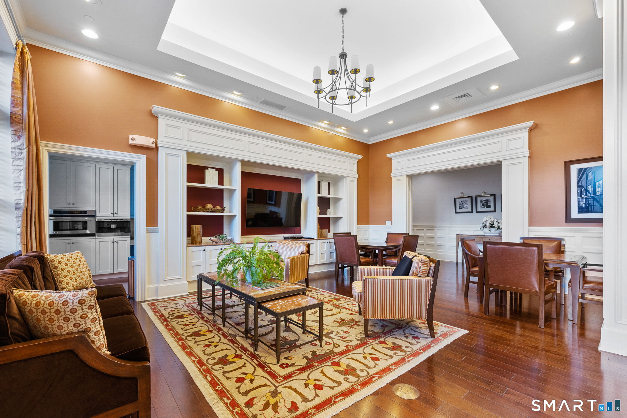 85 Memorial Road, Unit 205 West Hartford, CT 06107 - Photo 29 of 40 a living room with furniture chandelier and view of kitchen
