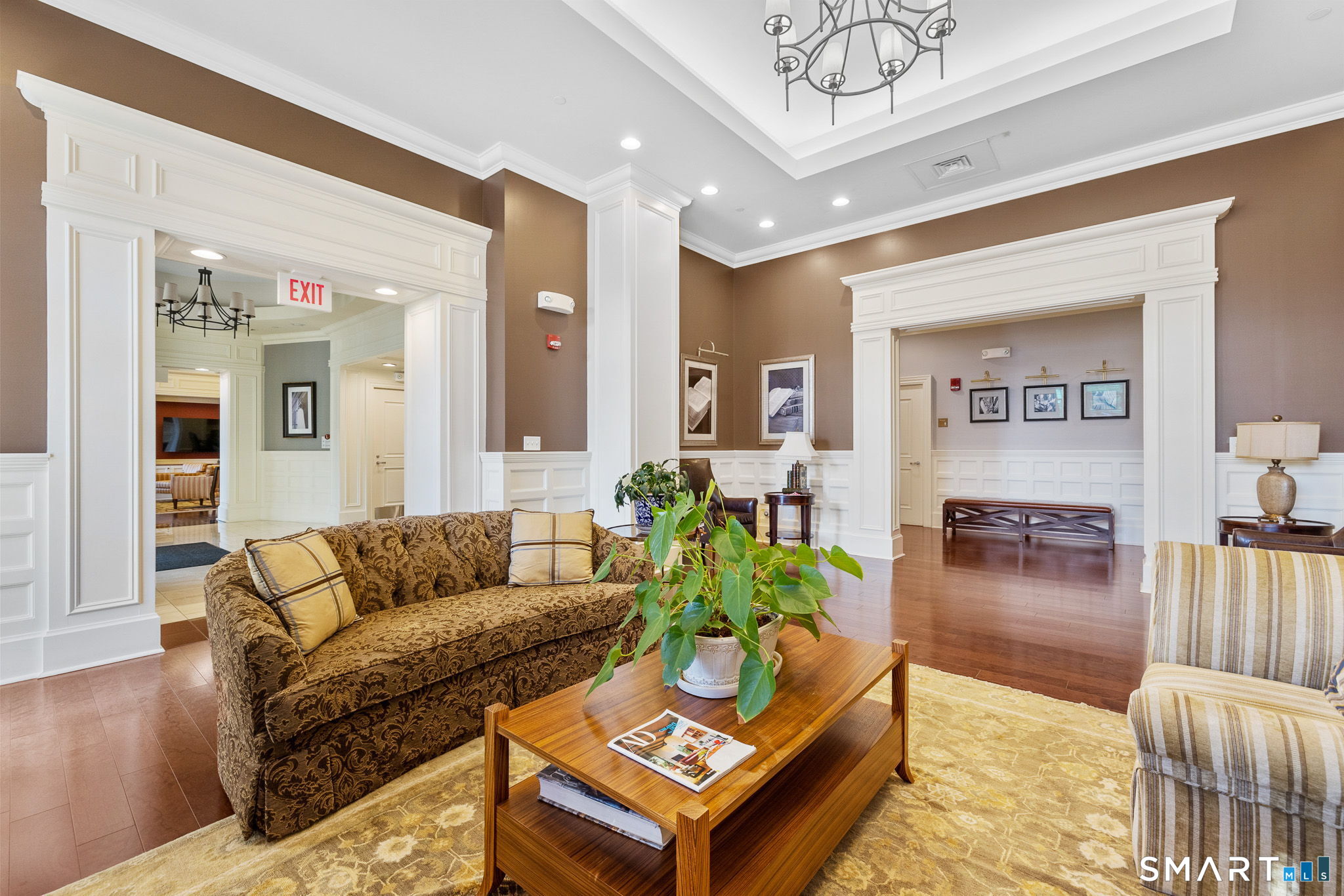 85 Memorial Road, Unit 205 West Hartford, CT 06107 - Photo 32 of 40 a living room with furniture and wooden floor