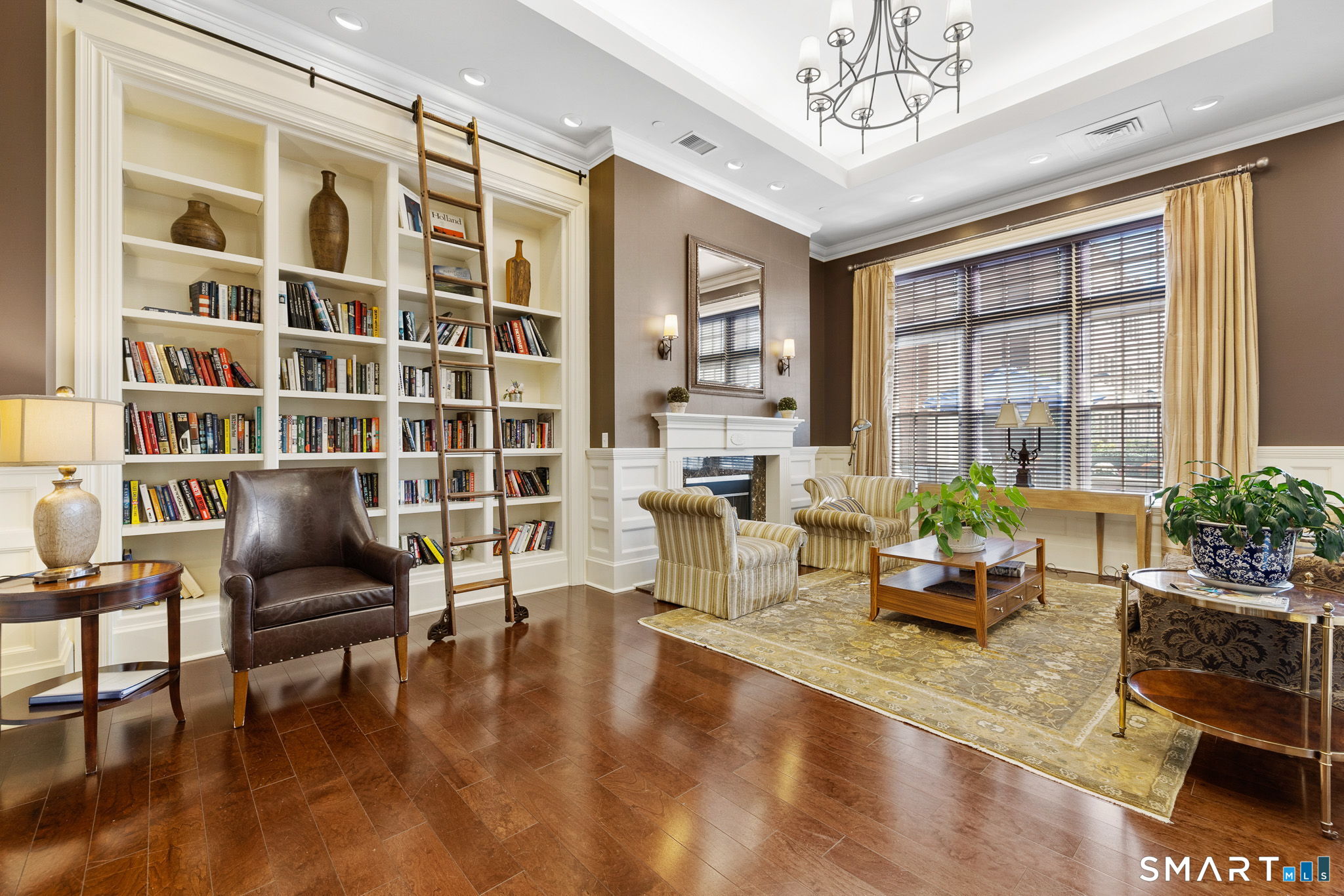 85 Memorial Road, Unit 205 West Hartford, CT 06107 - Photo 33 of 40 a living room with furniture and a large window