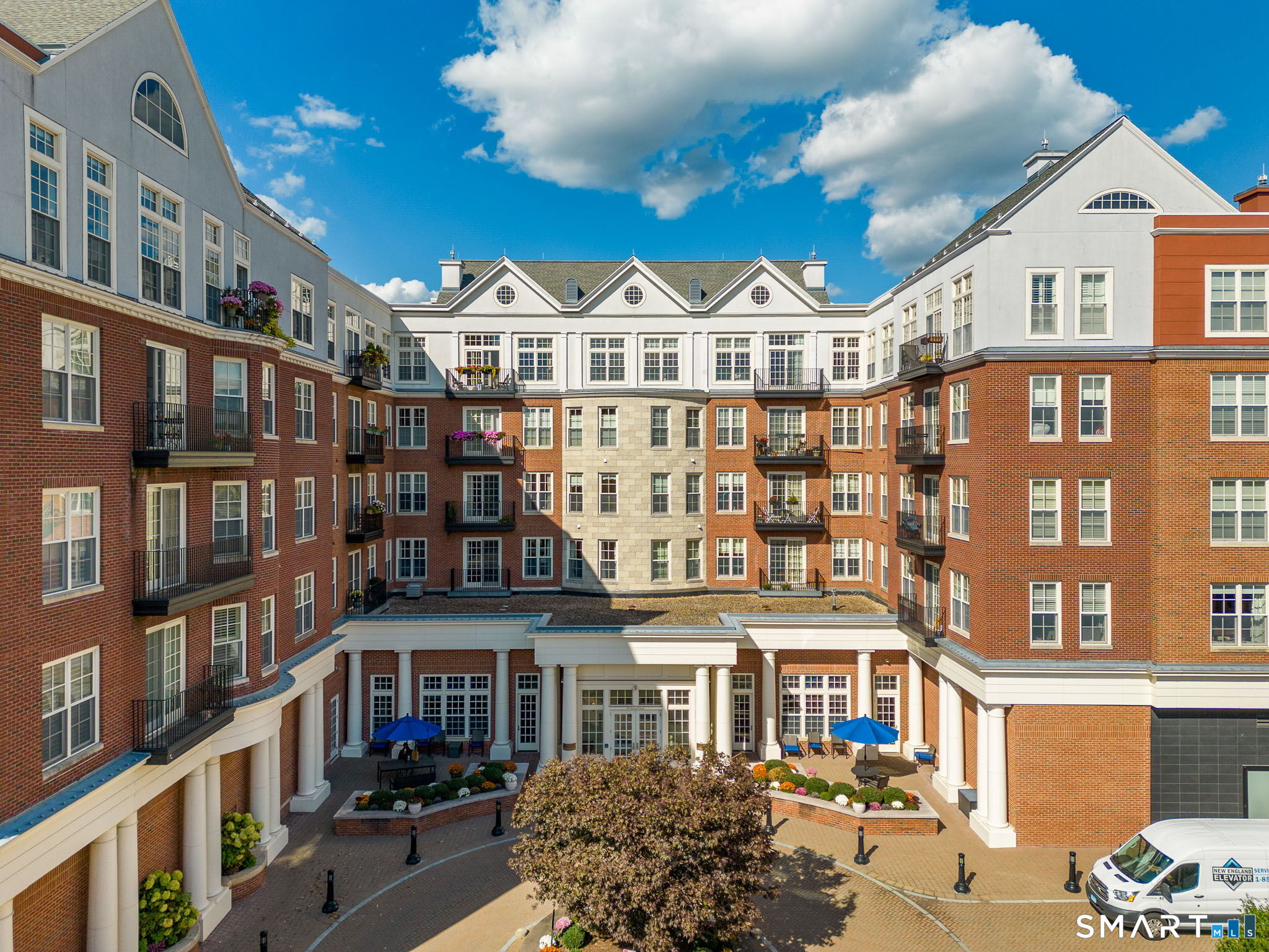 85 Memorial Road, Unit 205 West Hartford, CT 06107 - Photo 40 of 40 a view of a large building with a lot of windows