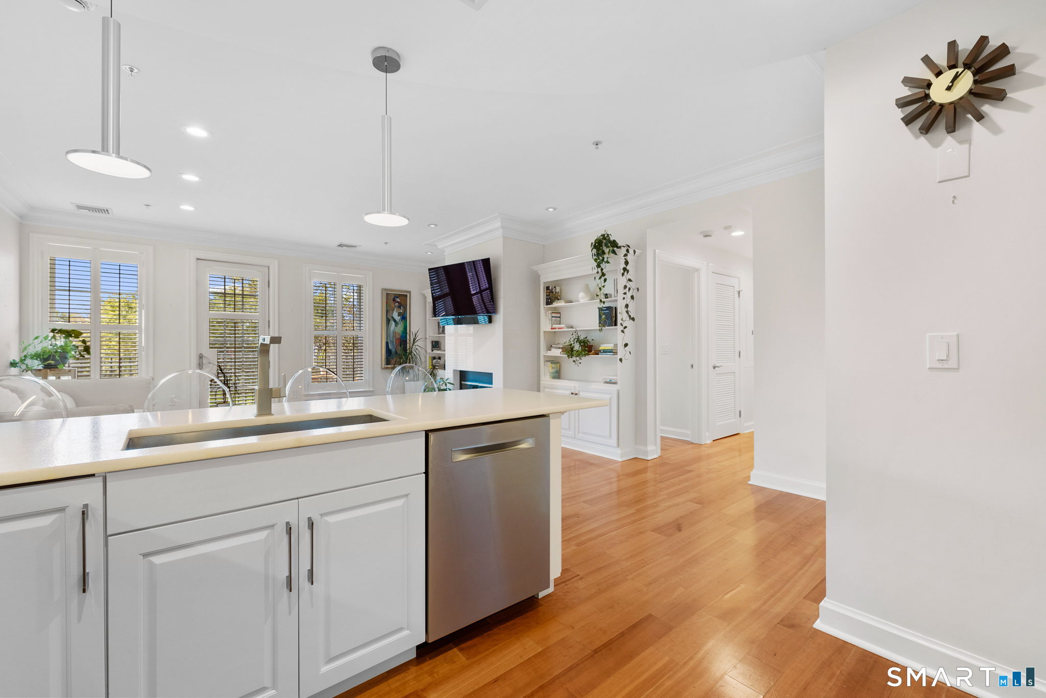85 Memorial Road, Unit 205 West Hartford, CT 06107 - Photo 7 of 40 a kitchen with white cabinets and sink