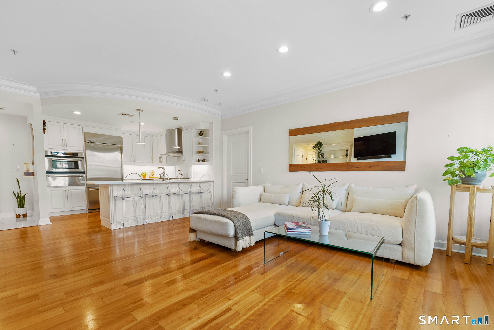 85 Memorial Road, Unit 205 West Hartford, CT 06107 - Photo 9 of 40 a living room with furniture and a large window
