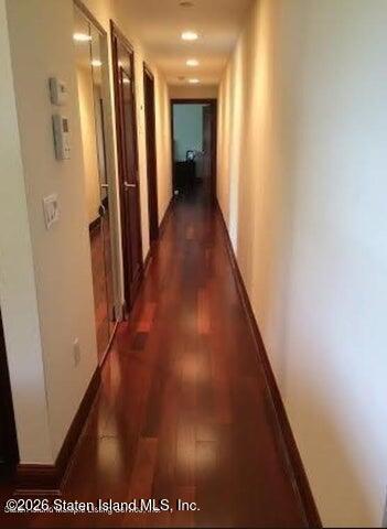 3871 Amboy Road, Unit 404 Staten Island, NY 10308 - Photo 7 of 17 a view of hallway with wooden floor