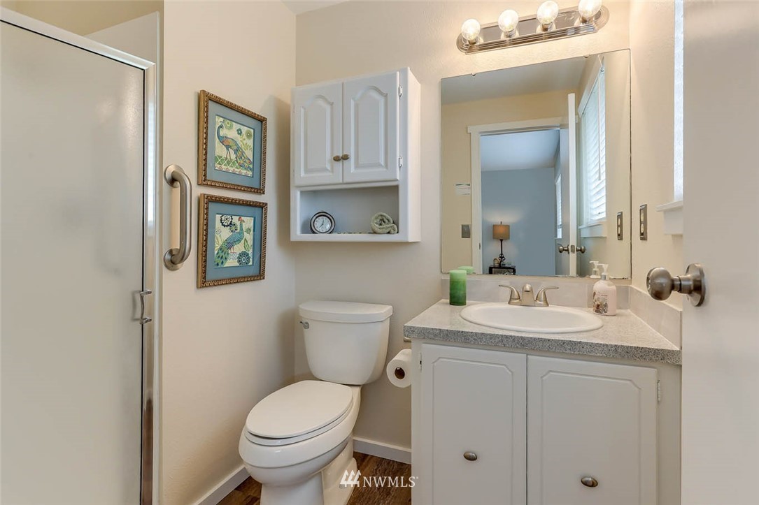 2805 Northeast 23rd Place Renton, WA 98056 - Photo 14 of 27 a bathroom with a toilet sink and mirror