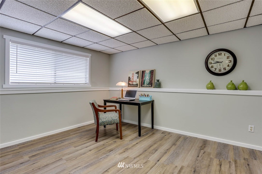 2805 Northeast 23rd Place Renton, WA 98056 - Photo 22 of 27 a workspace with furniture and wooden floor