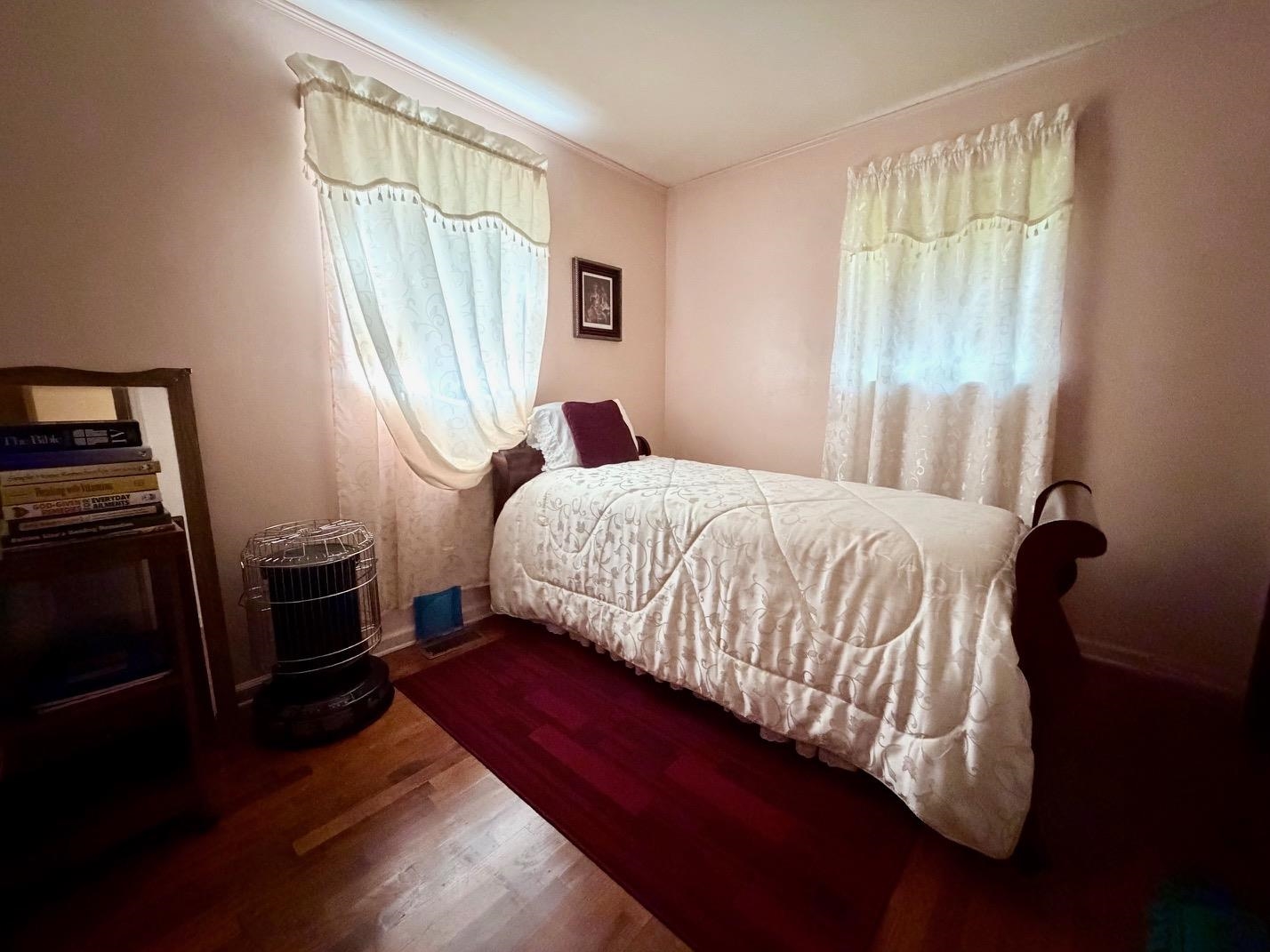 321 Pipkin Road Jackson, TN 38305 - Photo 12 of 16 a bedroom with a bed and a window