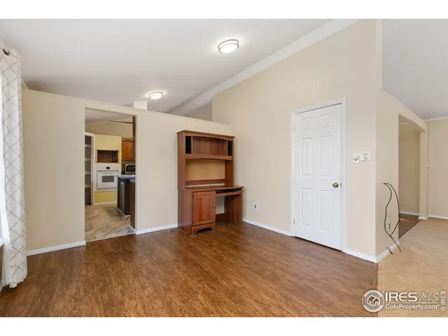 a view of kitchen with furniture and wooden floor