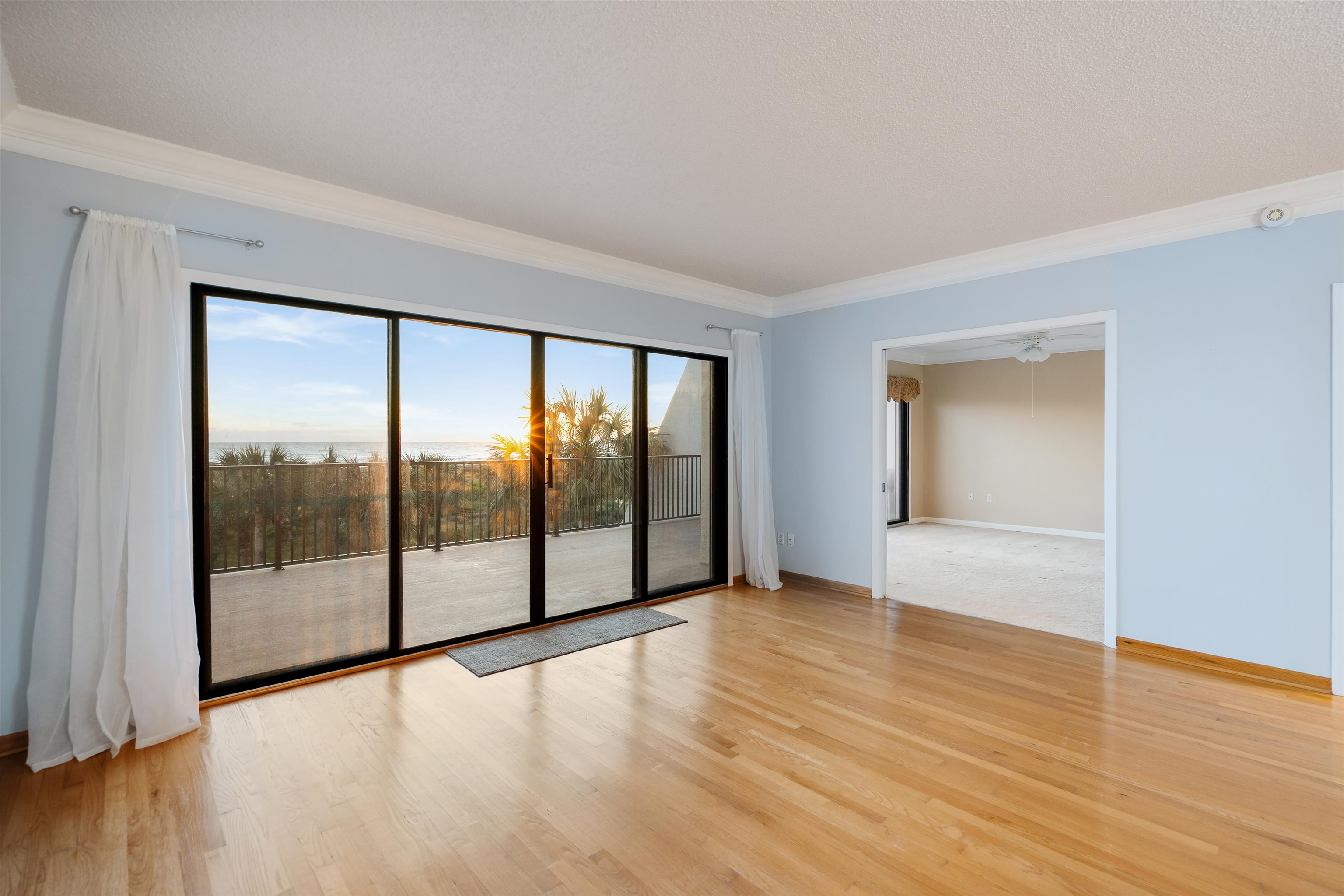 20 Dondanville Road, Unit A302 St. Augustine, FL 32080 - Photo 11 of 43 a view of an empty room with glass door