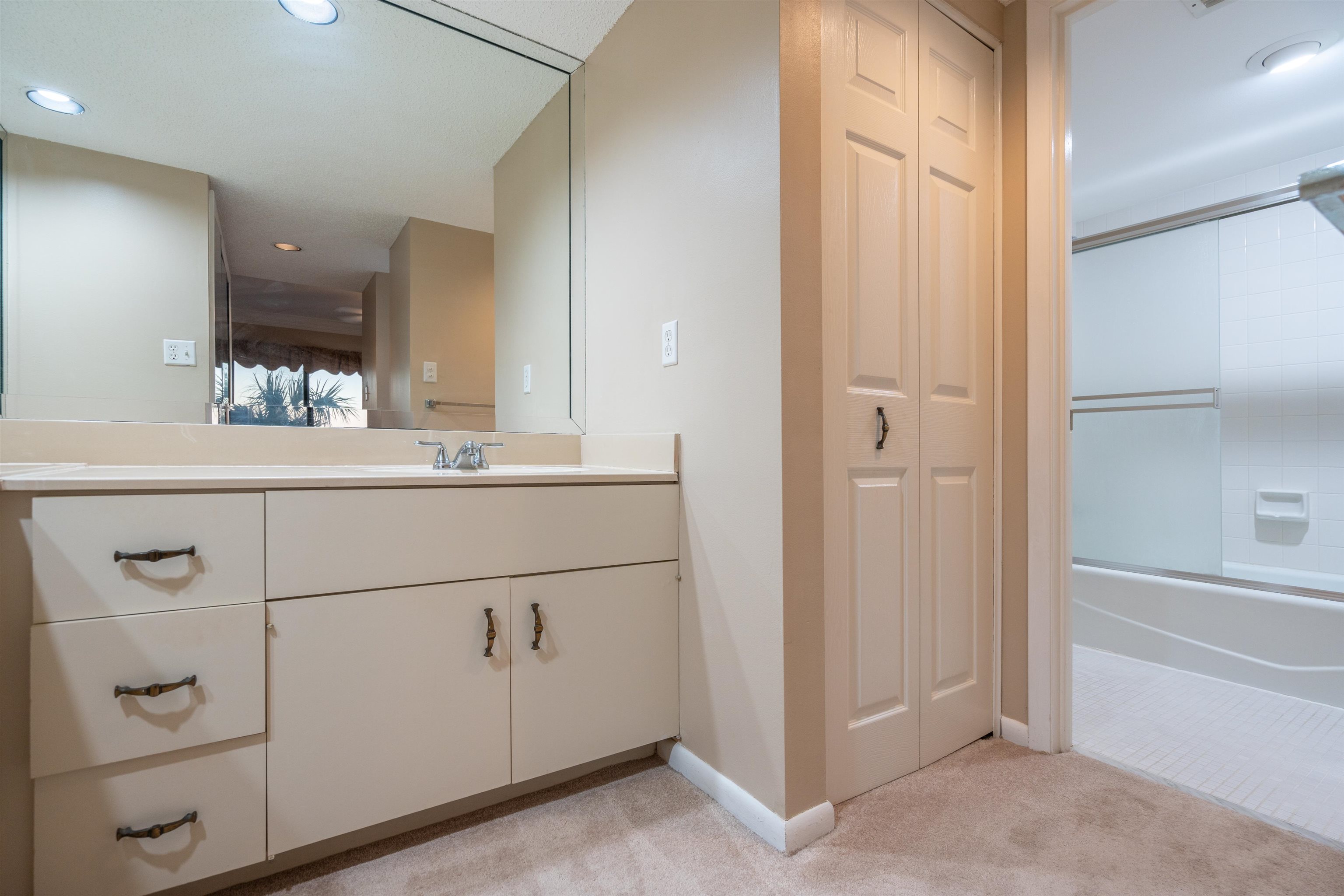 20 Dondanville Road, Unit A302 St. Augustine, FL 32080 - Photo 21 of 43 a bathroom with a sink and a mirror