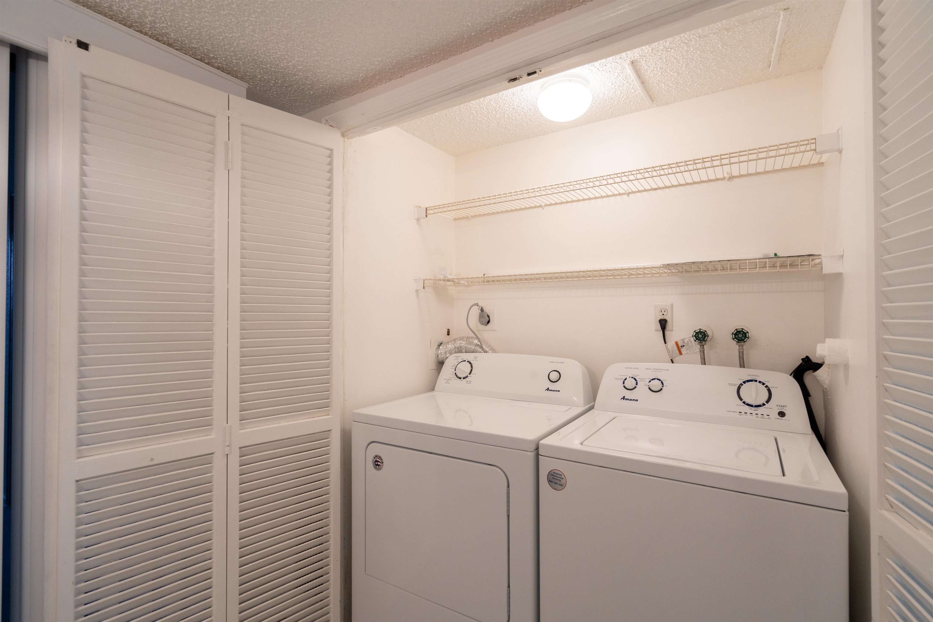 20 Dondanville Road, Unit A302 St. Augustine, FL 32080 - Photo 29 of 43 a utility room with dryer and washer