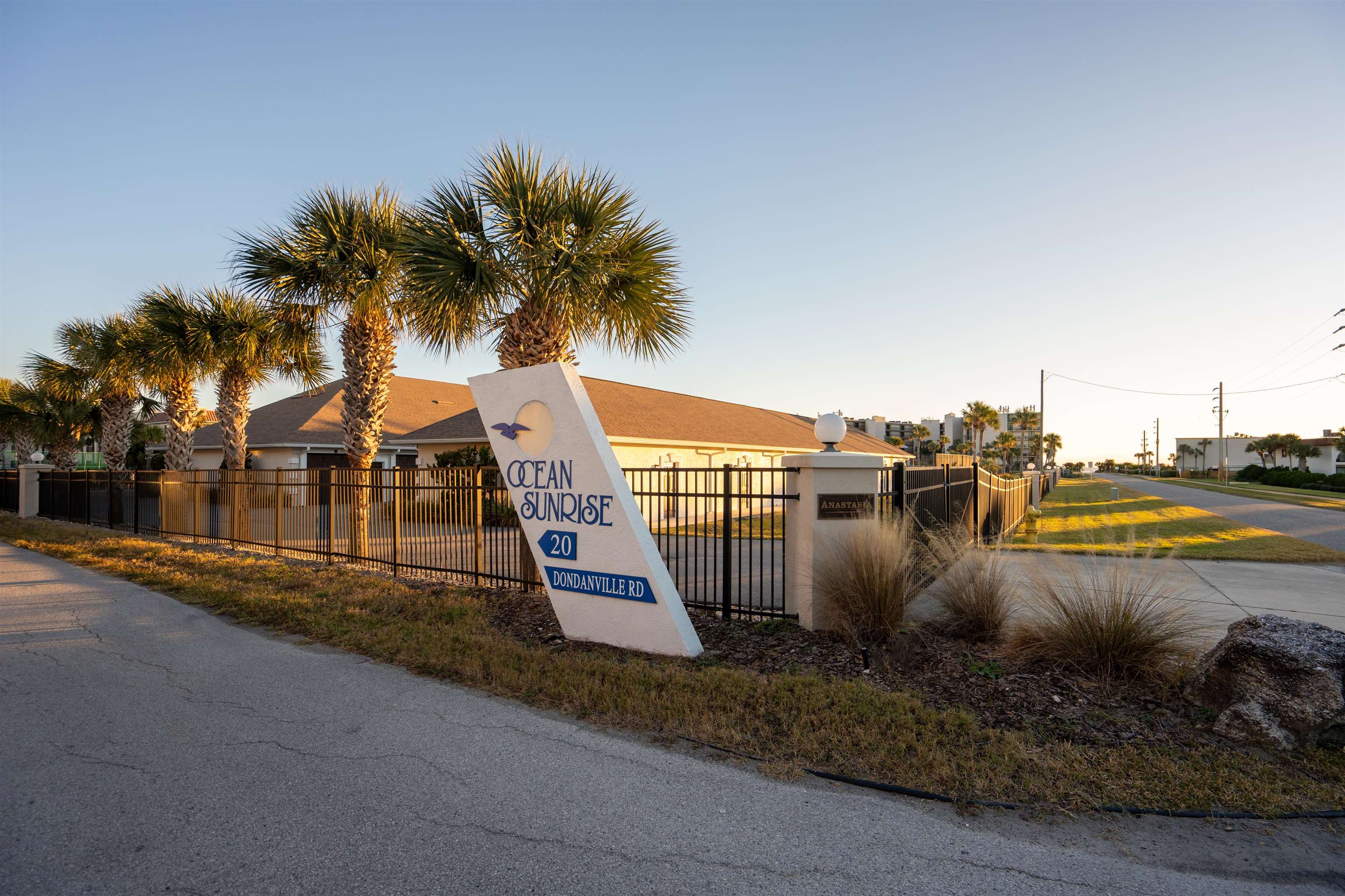 20 Dondanville Road, Unit A302 St. Augustine, FL 32080 - Photo 30 of 43 a view of a swimming pool with a lawn chairs and palm trees