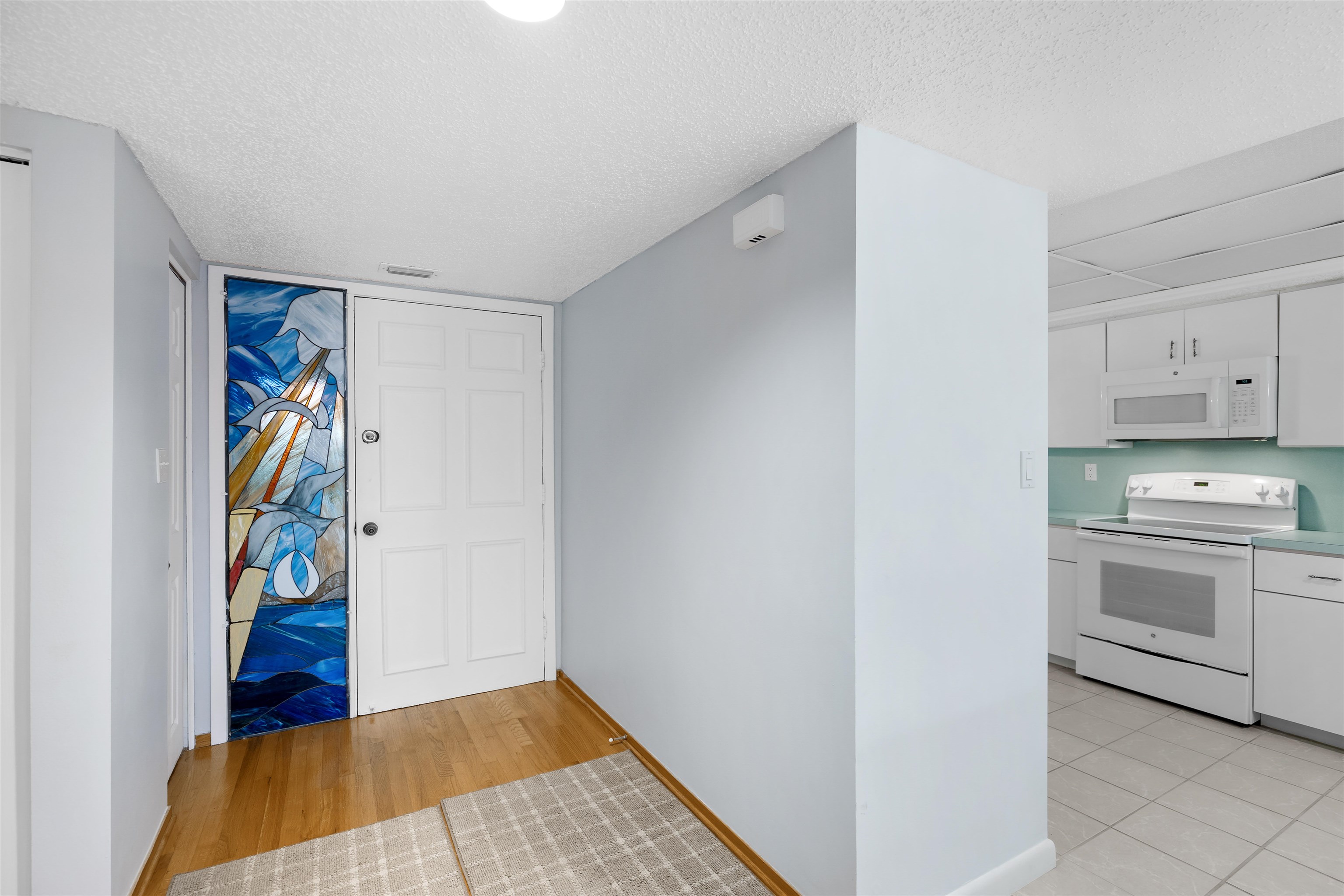 20 Dondanville Road, Unit A302 St. Augustine, FL 32080 - Photo 3 of 43 a view of a kitchen with fridge and sink