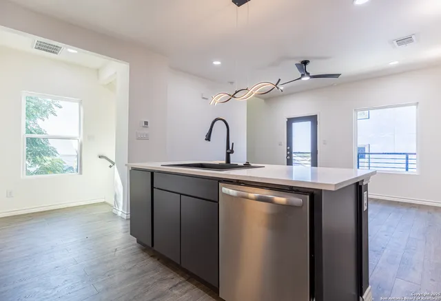 a kitchen with a sink and a window