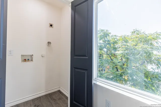 a white toilet sitting next to a window