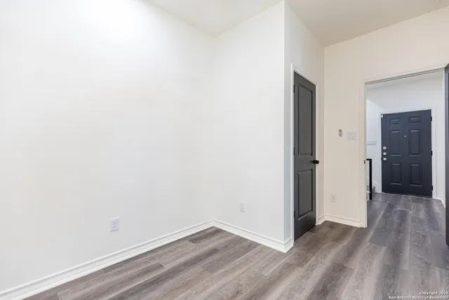 a bathroom with a sink a toilet a mirror and shower