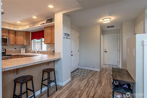 a bedroom with a bed and a sink