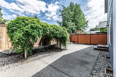 a backyard of a house with lots of green space