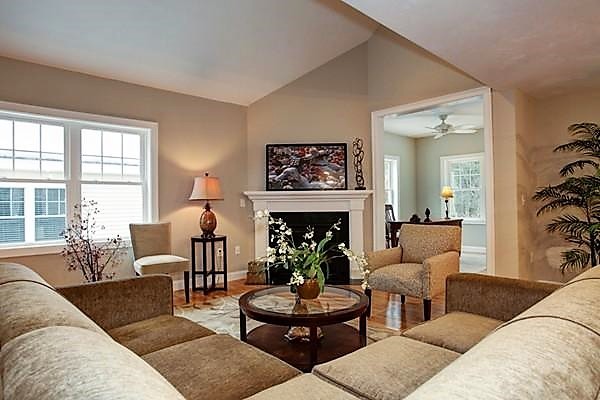 3 Trail Ridge Way, Unit 3A Harvard, MA 01451 - Photo 5 of 19 a living room with furniture a fireplace and a large window