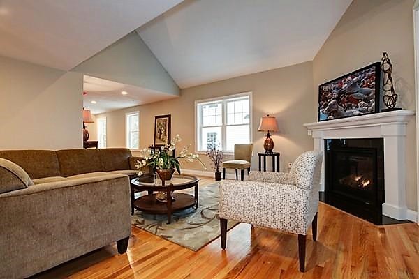 3 Trail Ridge Way, Unit 3A Harvard, MA 01451 - Photo 6 of 19 a living room with furniture and a fireplace