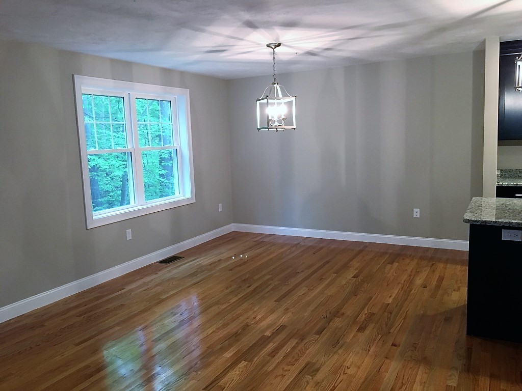 3 Trail Ridge Way, Unit 3A Harvard, MA 01451 - Photo 9 of 19 wooden floor in an empty room with a window