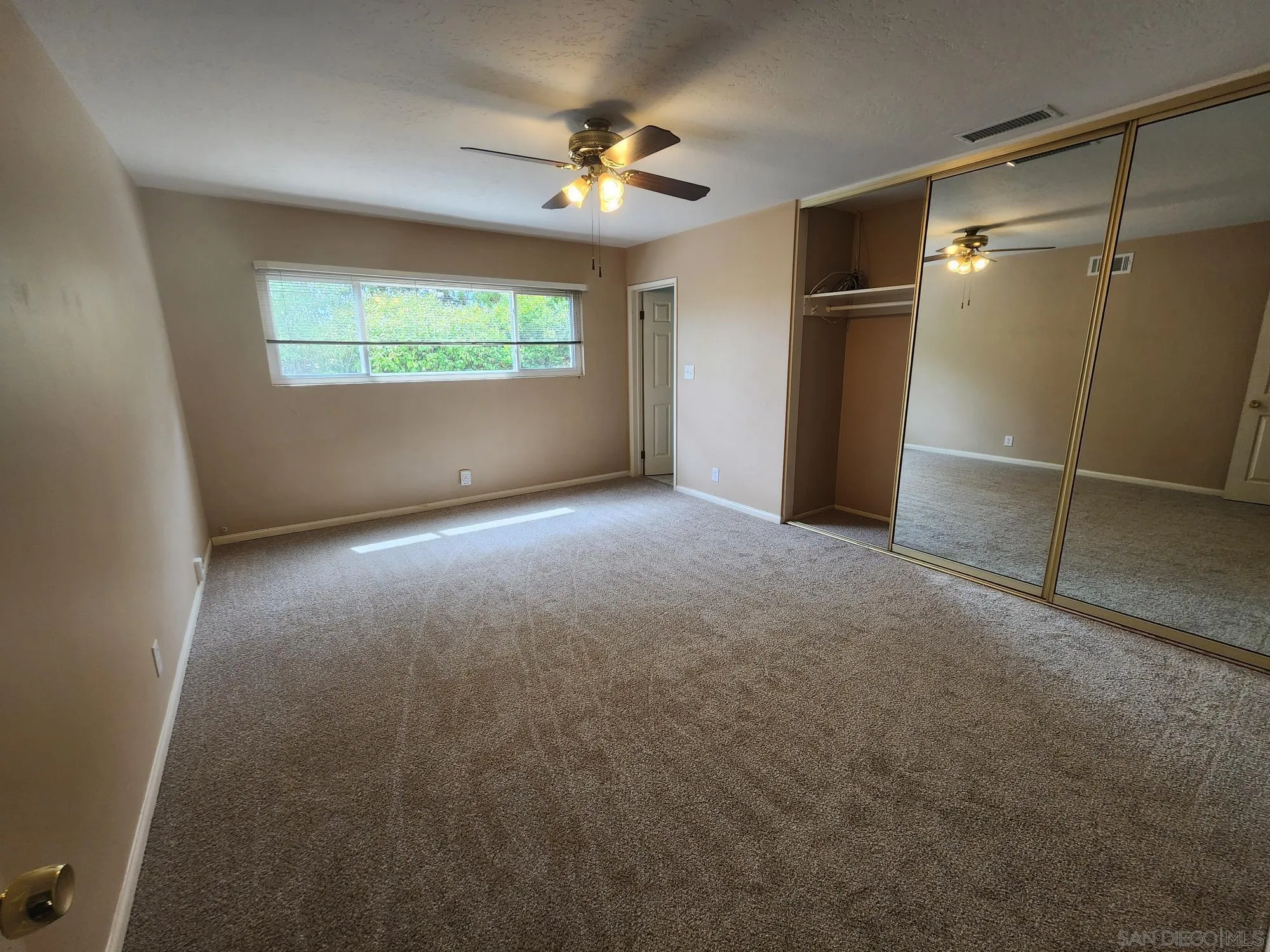 1972 Buena Creek Road Vista, CA 92084 - Photo 17 of 22 a view of an empty room with a window