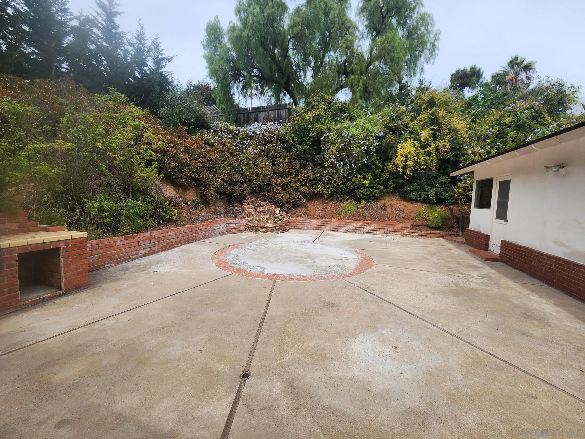 1972 Buena Creek Road Vista, CA 92084 - Photo 19 of 22 a backyard of a house with yard and outdoor seating