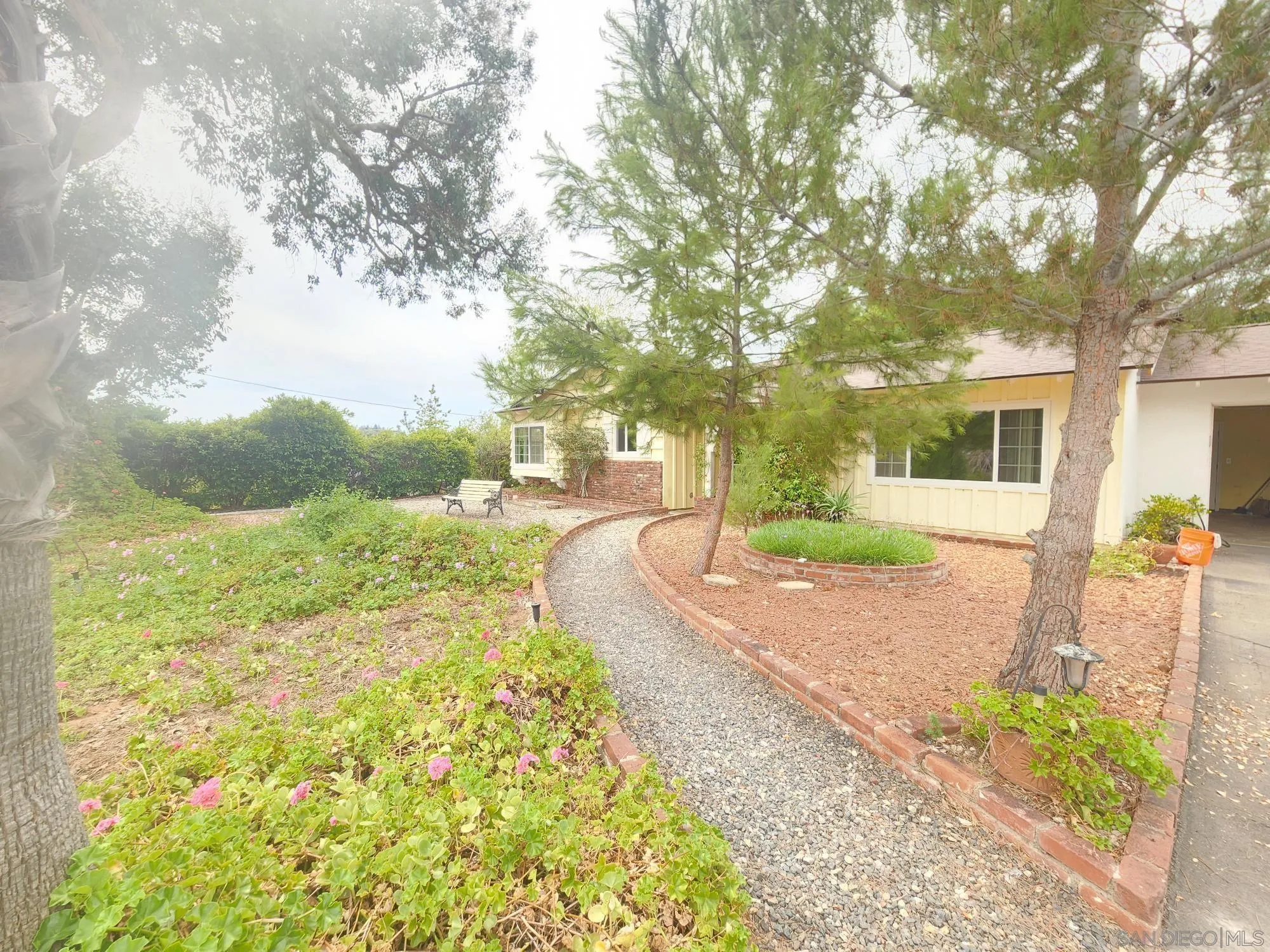 1972 Buena Creek Road Vista, CA 92084 - Photo 2 of 22 a view of a house with backyard and garden