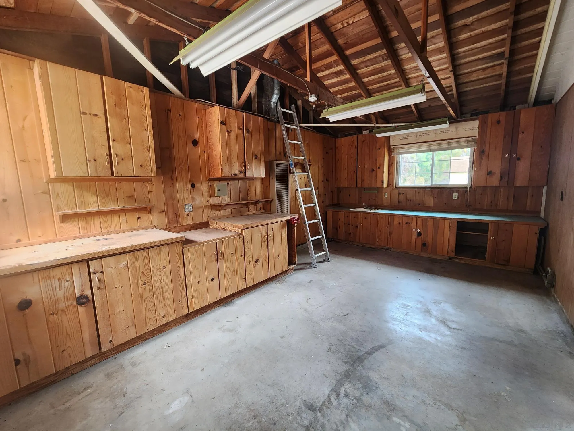 1972 Buena Creek Road Vista, CA 92084 - Photo 22 of 22 a big room with wooden cabinets and stainless steel appliances