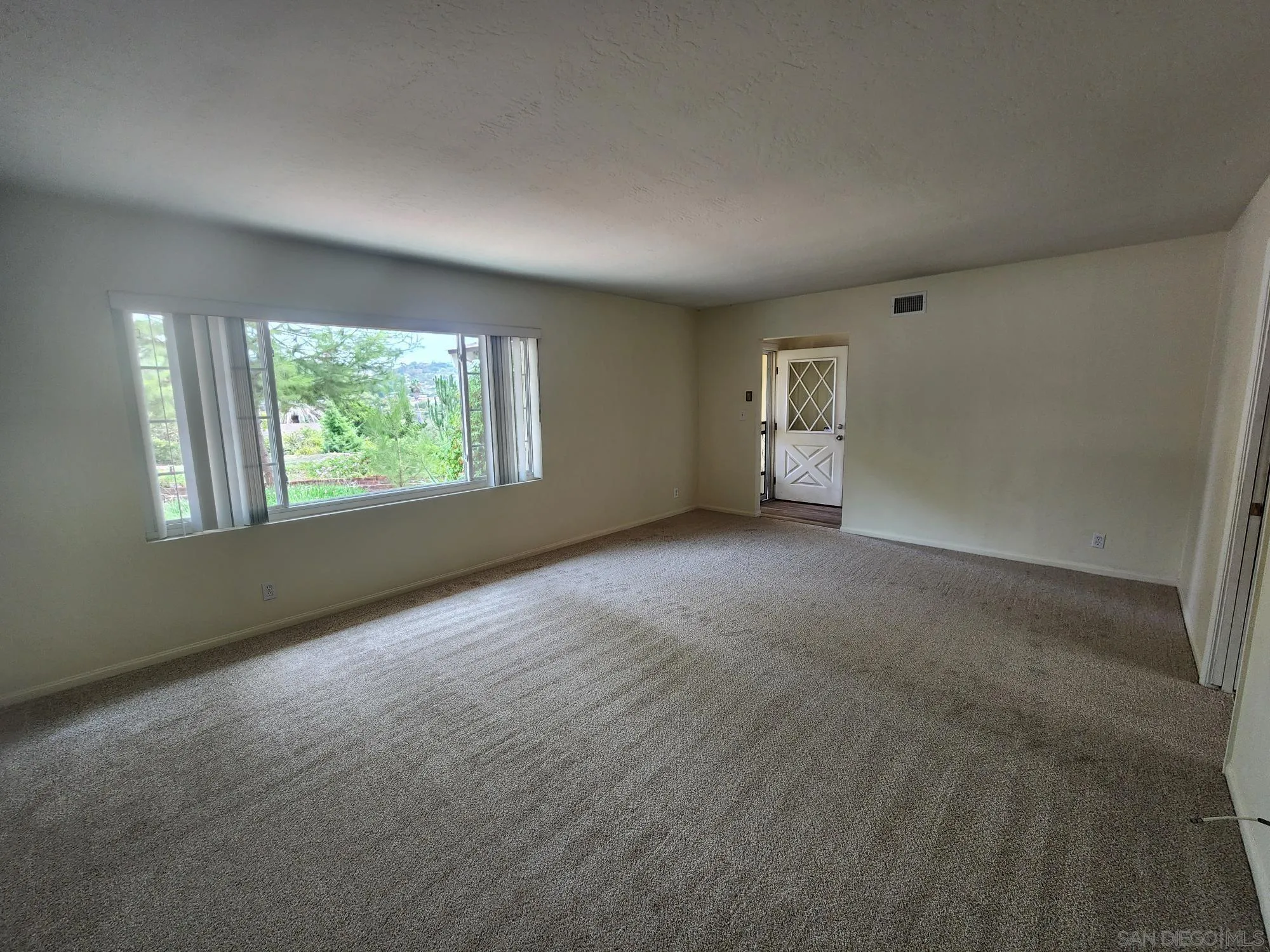 1972 Buena Creek Road Vista, CA 92084 - Photo 5 of 22 a view of an empty room with windows