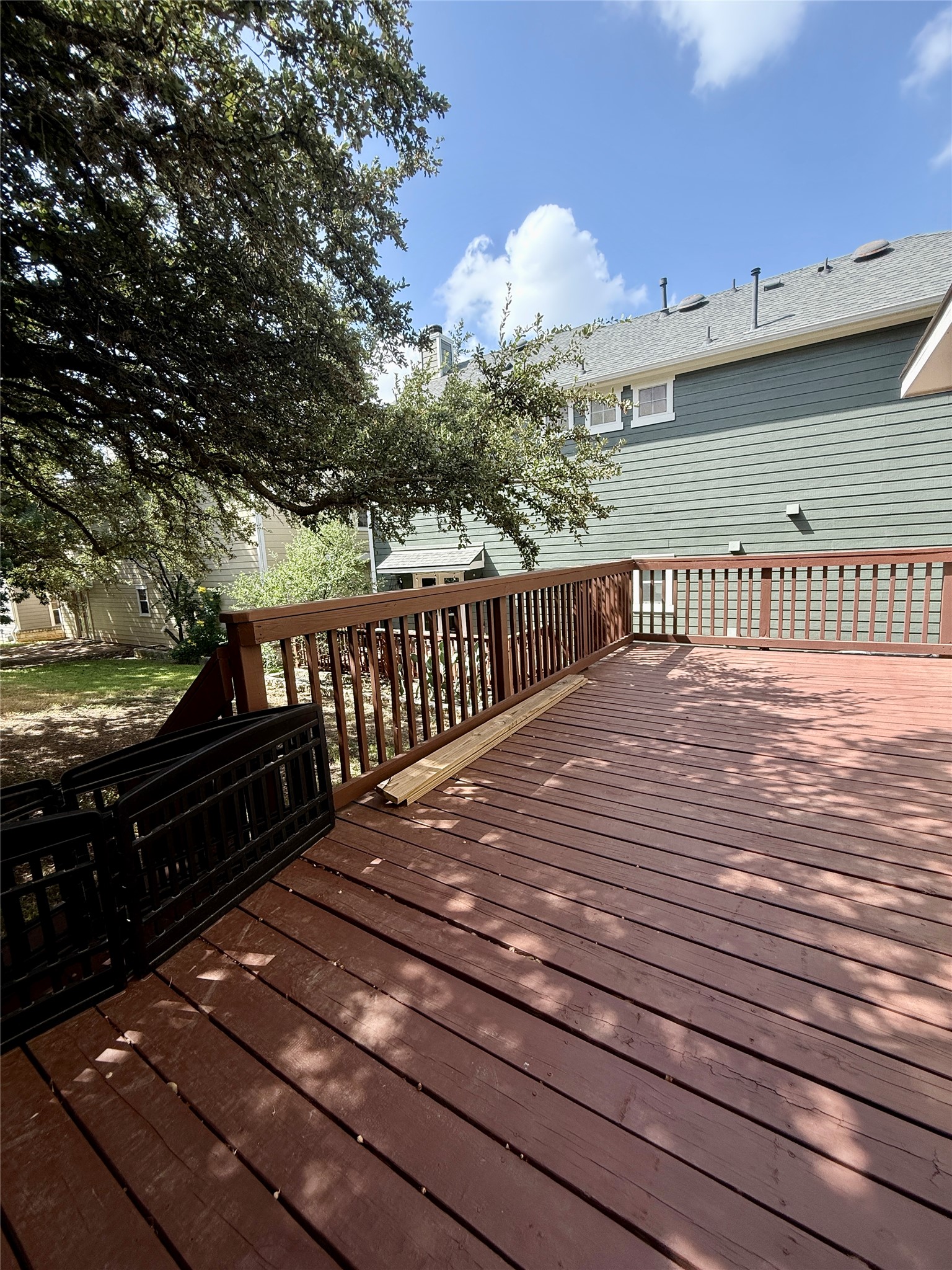 411 West St Elmo Road, Unit 39 Austin, TX 78745 - Photo 19 of 25 Mature trees shade a spacious wooden deck