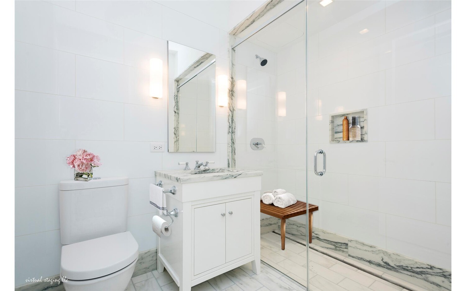 10 Madison Square West, Unit 14F Manhattan, NY 10010 - Photo 10 of 12 a bathroom with a toilet a sink and a mirror