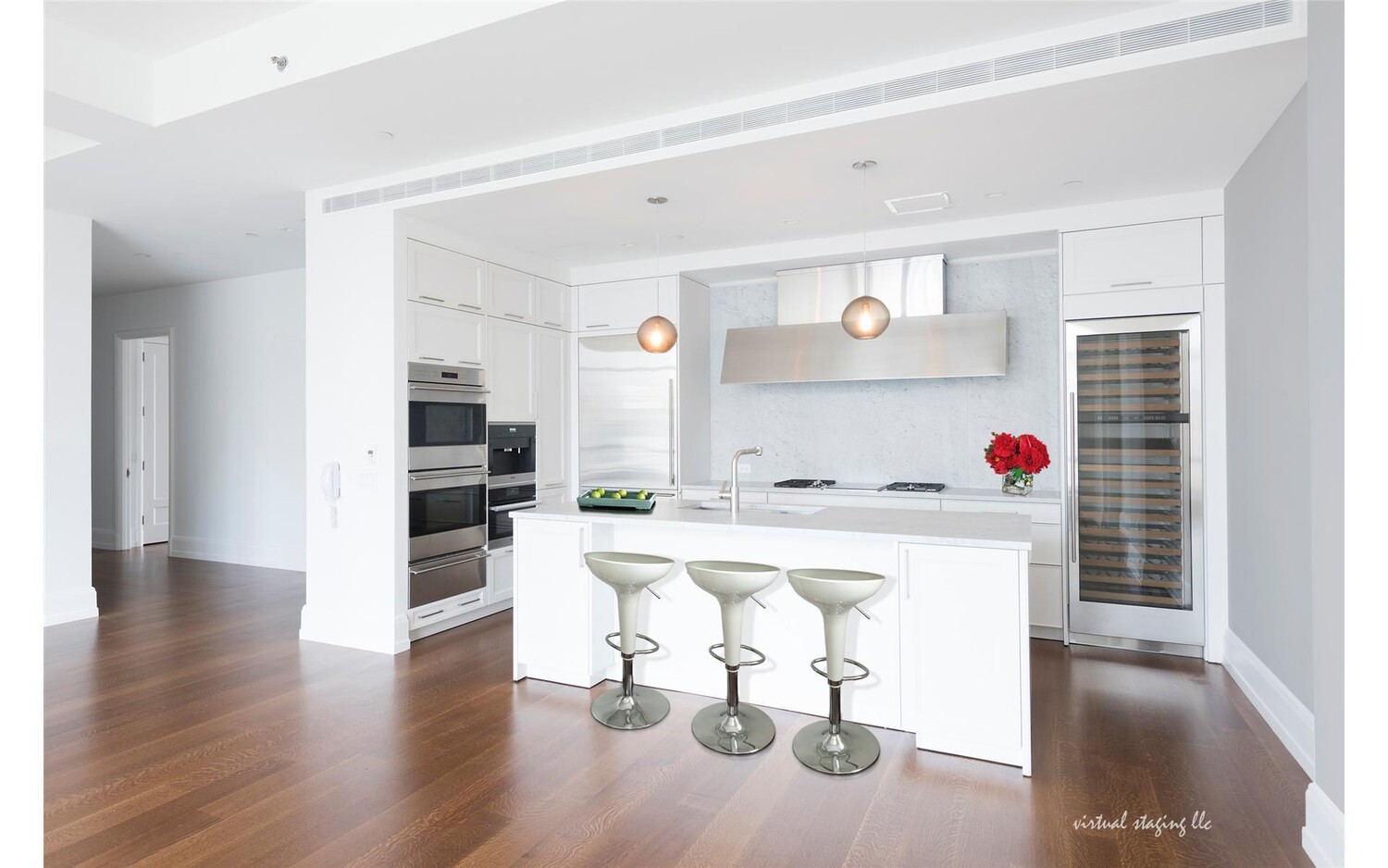 10 Madison Square West, Unit 14F Manhattan, NY 10010 - Photo 3 of 12 a living room with furniture and a wooden floor