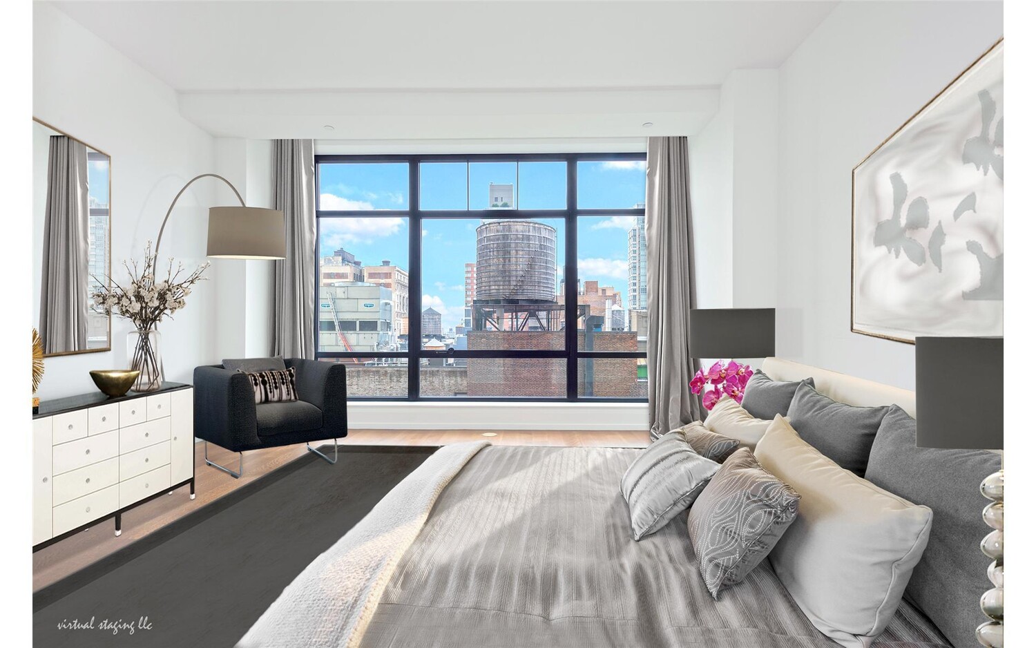 10 Madison Square West, Unit 14F Manhattan, NY 10010 - Photo 7 of 12 a bedroom with a bed and a large window